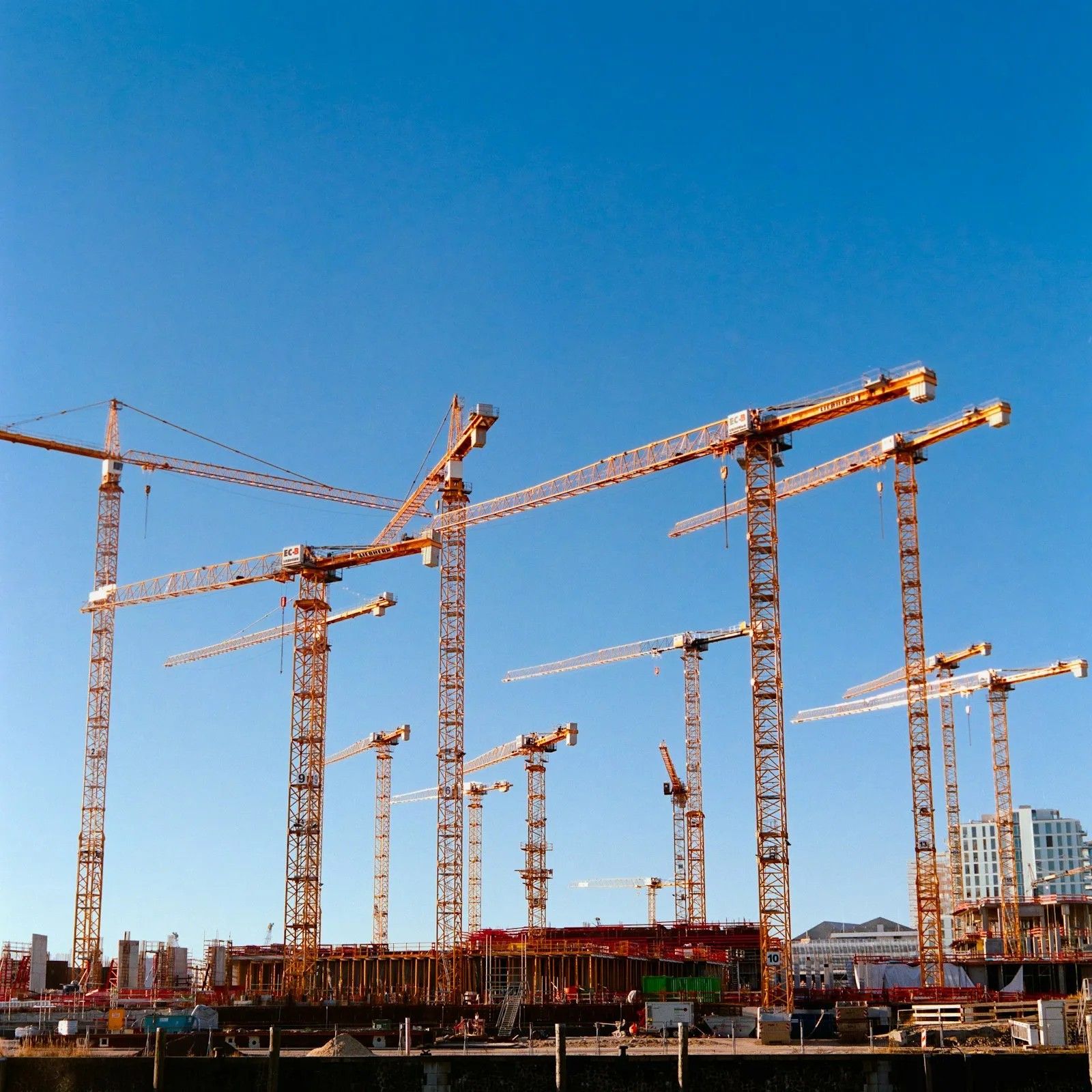 Construction cranes over a large build site
